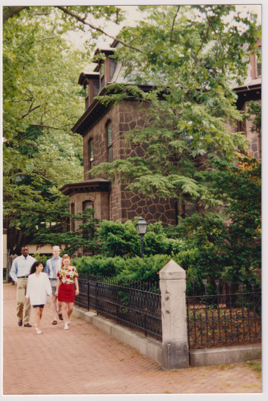 Admissions Building with 4 People Walking from the Front