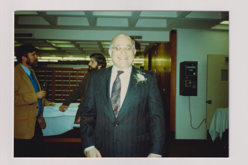 Man Wearing a Corsage at Library Party