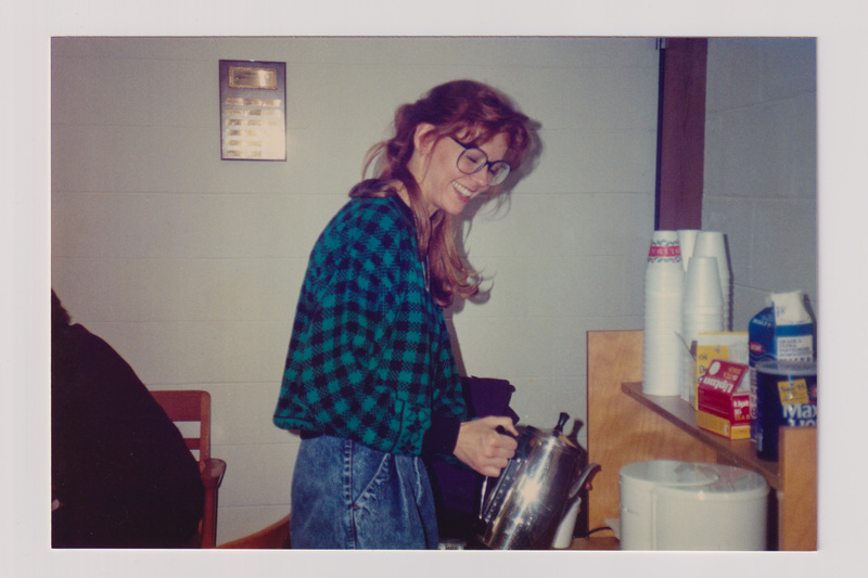 Woman Laughing with a Coffee Pot