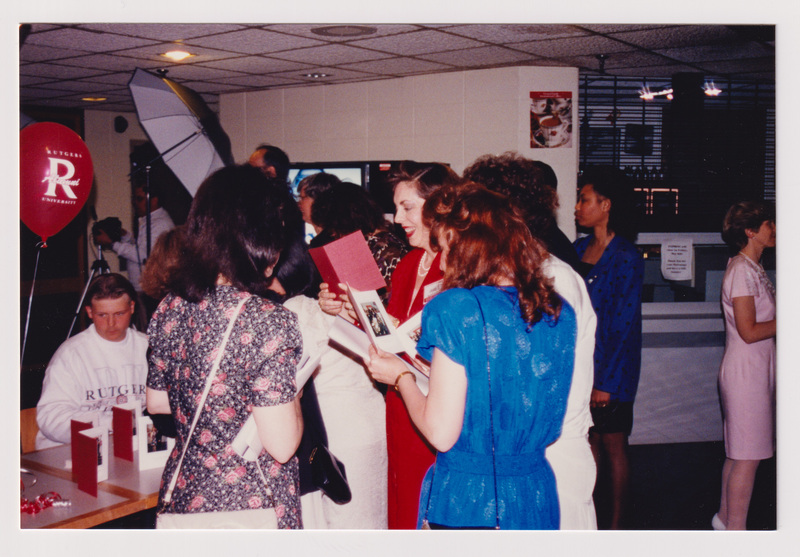Looking at Photo Pamphlets at the Reunion