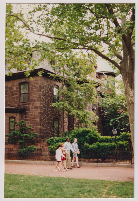 Admissions Building with 4 People Walking from Distance in Line