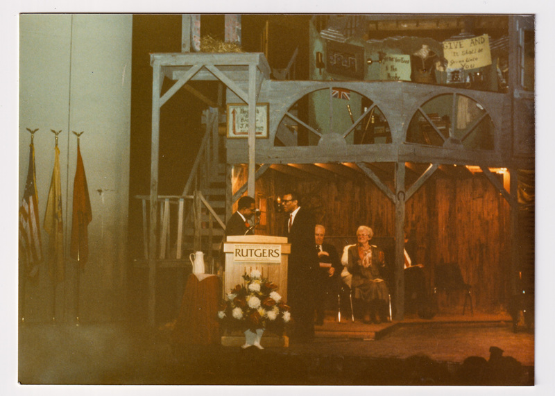 Paul Robeson Jr. Shakes hands on stage at Dedication Ceremony