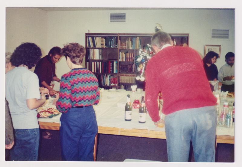 People Surround a Refreshment Table