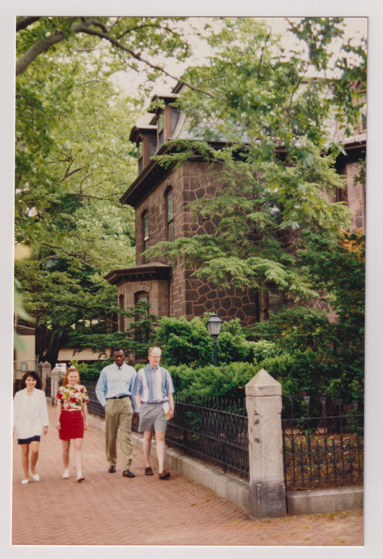 Admissions Building with 4 People Walking Near the Corner