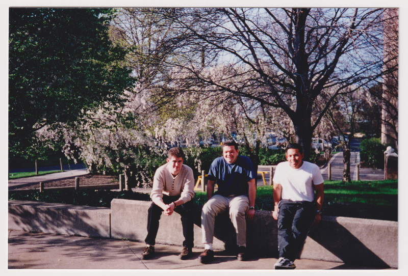 Three Students in Courtyard