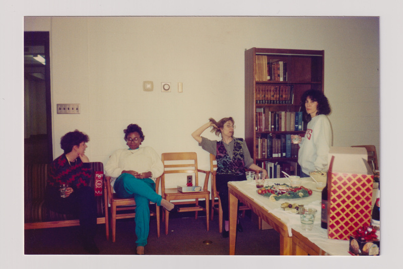 Four Women Sitting at a Holiday Party